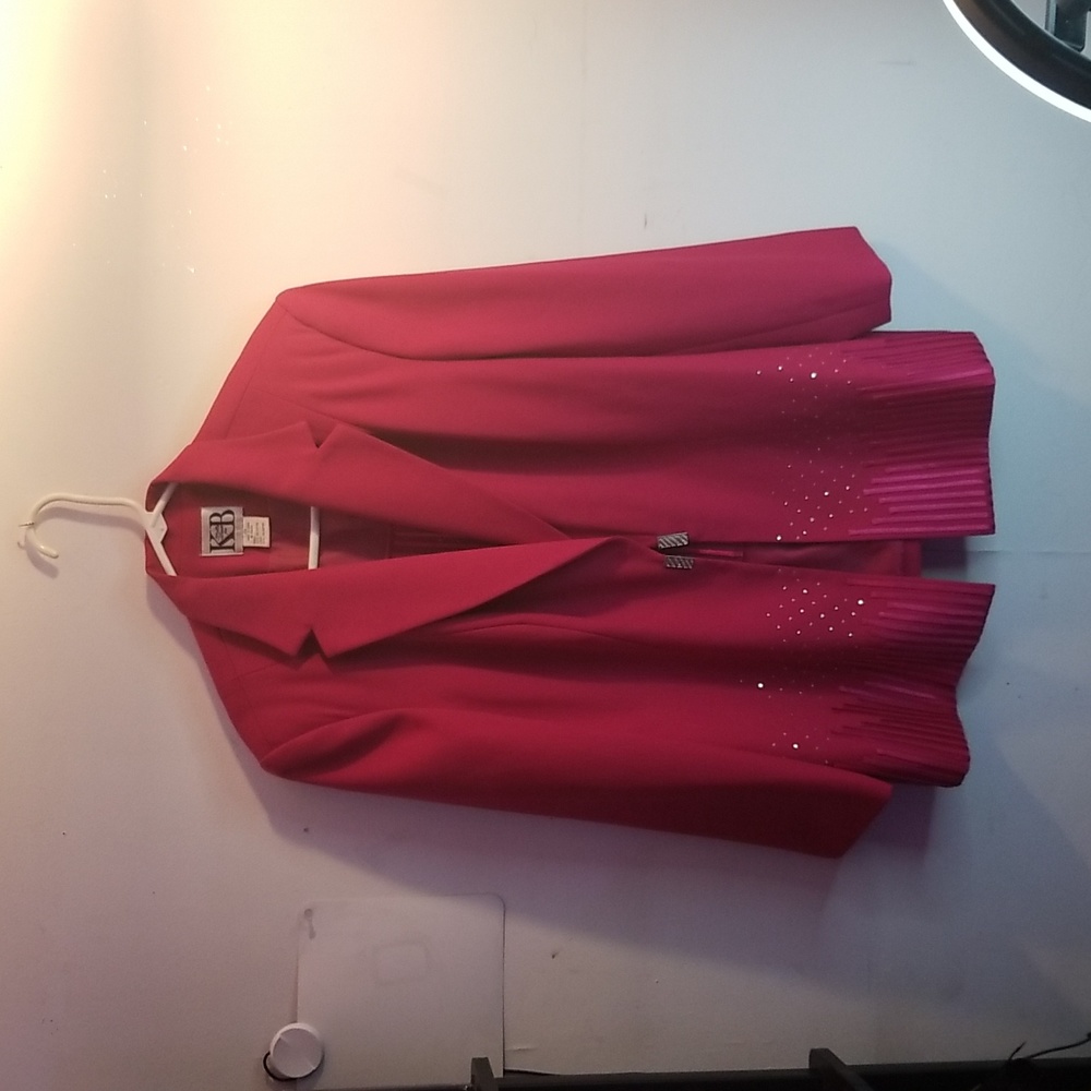 Suit size ex large color fuschia. Studded jacket with studded attached vest